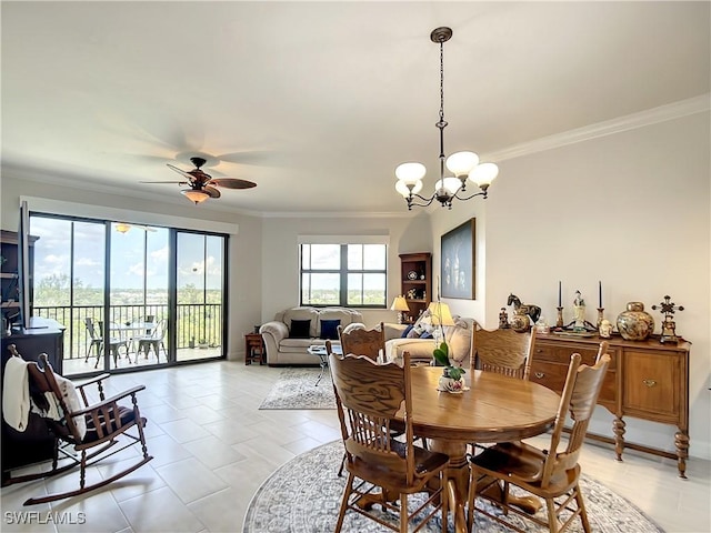 dining room with light tile patterned floors, ceiling fan with notable chandelier, crown molding, and baseboards