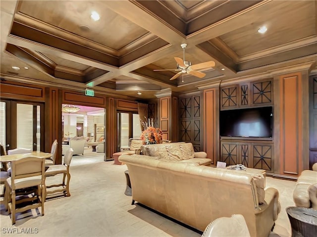 living area with beamed ceiling, light carpet, ornamental molding, coffered ceiling, and ceiling fan