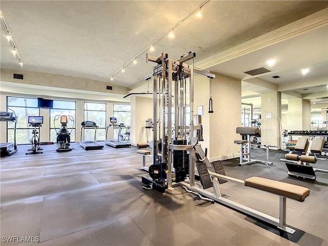 gym featuring track lighting, baseboards, and visible vents