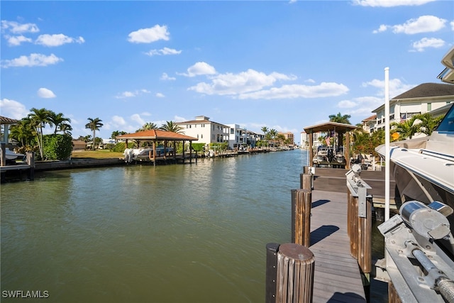 view of dock featuring boat lift and a water view