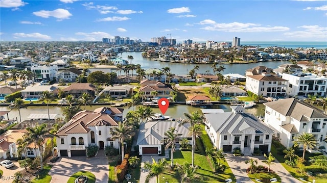 bird's eye view with a water view and a residential view