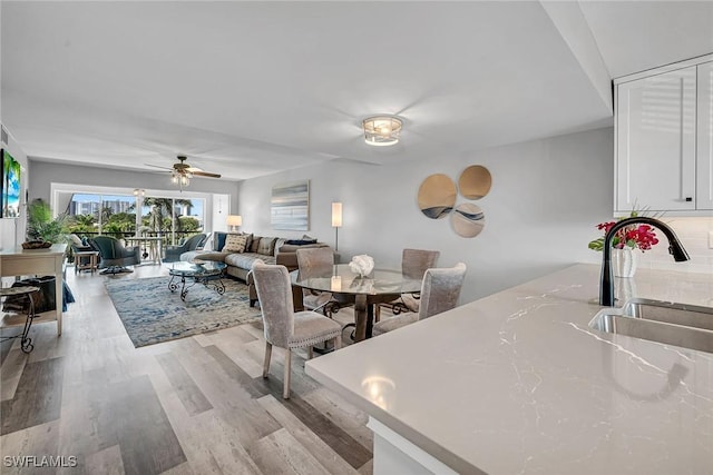 4200 Belair Ln Unit 303, Naples, FL 34103 - dining area featuring light wood-style flooring and a ceiling fan