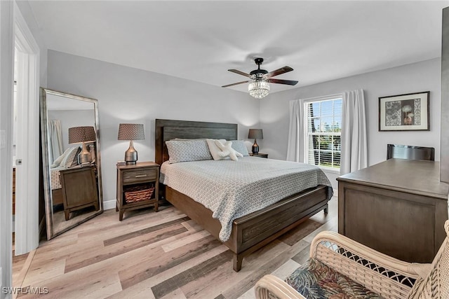 4200 Belair Ln Unit 303, Naples, FL 34103 - bedroom with light wood-type flooring and ceiling fan