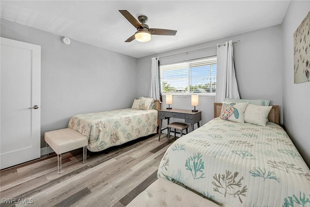 4200 Belair Ln Unit 303, Naples, FL 34103 - bedroom with a ceiling fan and wood finished floors