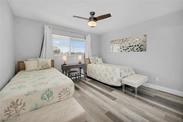 4200 Belair Ln Unit 303, Naples, FL 34103 - bedroom with ceiling fan, baseboards, and wood finished floors