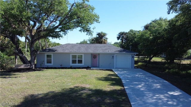 ranch-style house featuring stucco siding, a front yard, concrete driveway, and an attached garage
