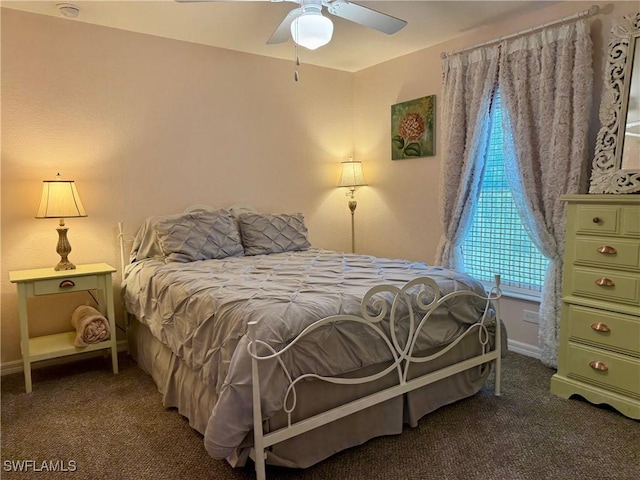 carpeted bedroom with baseboards and a ceiling fan