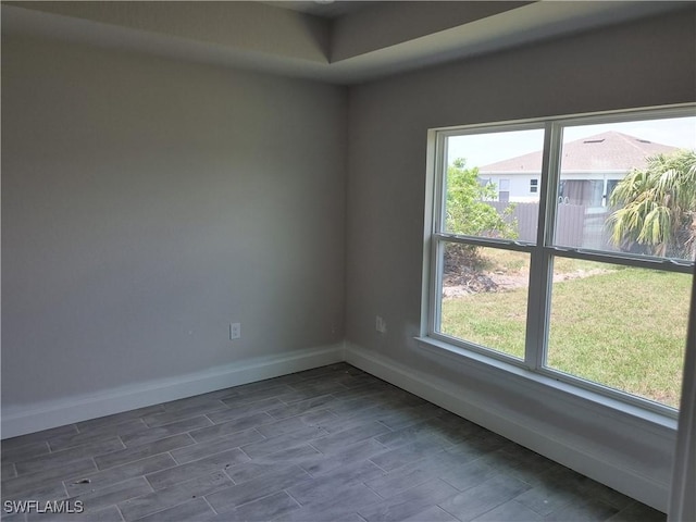 1127 NW 14th Ter, Cape Coral, FL 33993 - empty room with baseboards and dark wood finished floors