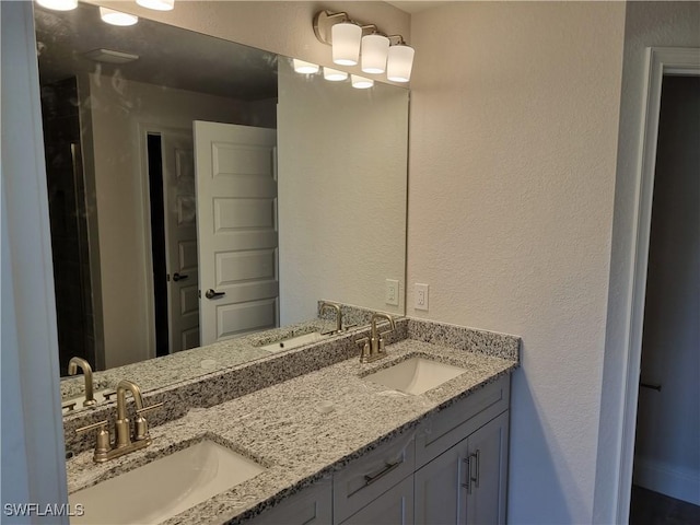 1127 NW 14th Ter, Cape Coral, FL 33993 - bathroom with double vanity and a textured wall
