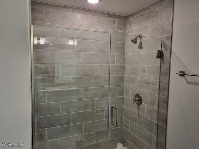1127 NW 14th Ter, Cape Coral, FL 33993 - bathroom featuring a shower stall