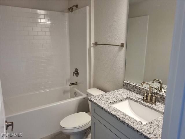 1127 NW 14th Ter, Cape Coral, FL 33993 - bathroom featuring a textured wall, toilet, vanity, and shower / bath combination