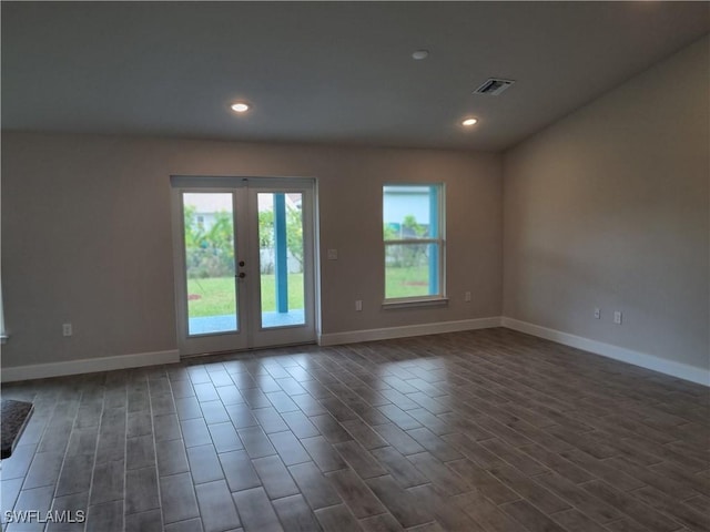 1127 NW 14th Ter, Cape Coral, FL 33993 - empty room with baseboards, recessed lighting, dark wood-type flooring, and french doors