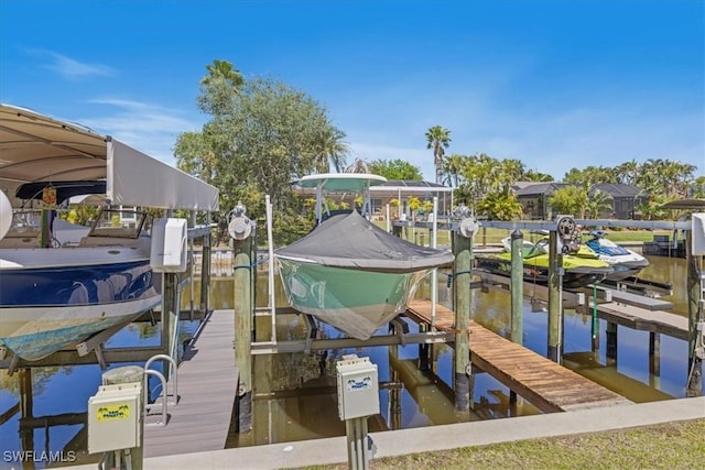 dock area featuring a water view and boat lift