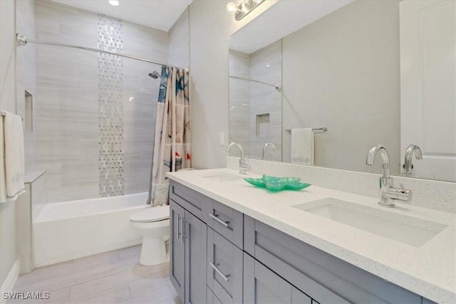 2312 4th Ave SE, Naples, FL 34117 - full bathroom with a sink, toilet, double vanity, and shower / bath combination with curtain