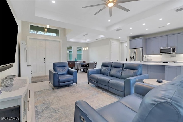 2312 4th Ave SE, Naples, FL 34117 - living room with recessed lighting, visible vents, a tray ceiling, and ceiling fan