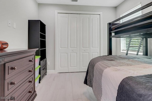 2312 4th Ave SE, Naples, FL 34117 - bedroom with light wood-style floors, a closet, and visible vents
