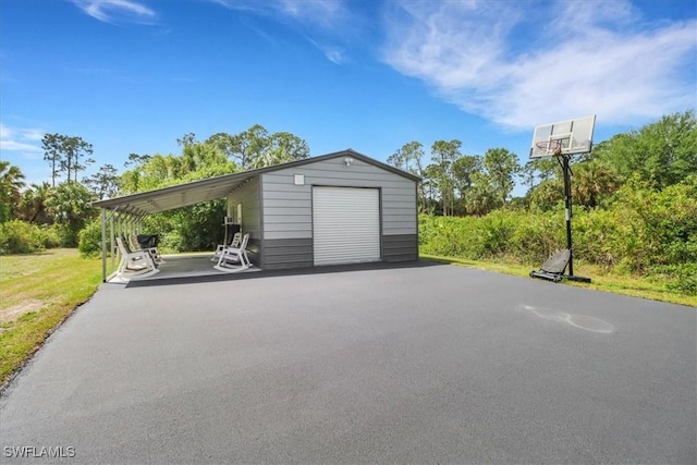 2312 4th Ave SE, Naples, FL 34117 - garage featuring a detached garage and aphalt driveway