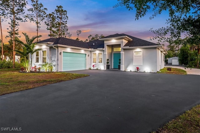 2312 4th Ave SE, Naples, FL 34117 - view of front of home featuring an attached garage, a shingled roof, driveway, and stucco siding