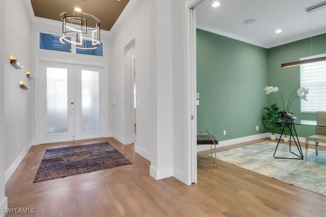 3721 Sapphire Cove Cir, Naples, FL 34114 - foyer featuring a chandelier, wood finished floors, french doors, and baseboards