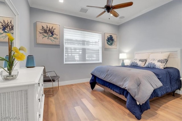 3721 Sapphire Cove Cir, Naples, FL 34114 - bedroom featuring light wood finished floors, baseboards, and ceiling fan