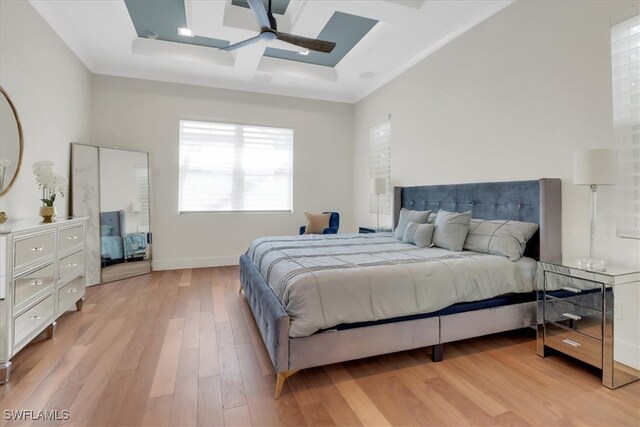 3721 Sapphire Cove Cir, Naples, FL 34114 - bedroom with coffered ceiling, light wood-style flooring, a skylight, a ceiling fan, and beamed ceiling
