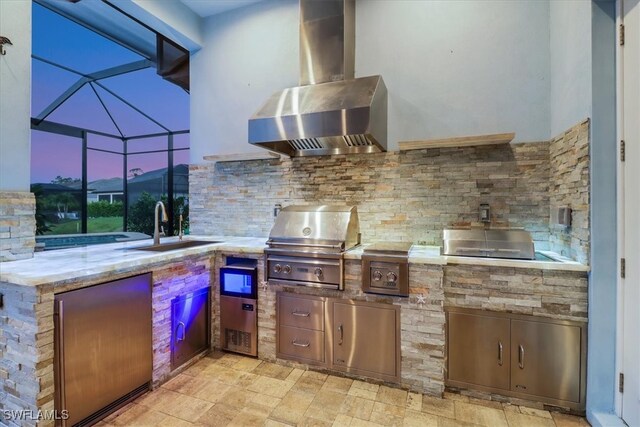 3721 Sapphire Cove Cir, Naples, FL 34114 - patio terrace at dusk featuring a sink and glass enclosure