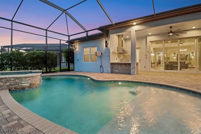 3721 Sapphire Cove Cir, Naples, FL 34114 - view of swimming pool featuring a patio area, a pool with connected hot tub, a ceiling fan, and glass enclosure