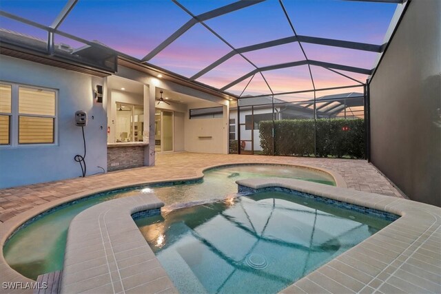 3721 Sapphire Cove Cir, Naples, FL 34114 - view of swimming pool featuring a patio, a pool with connected hot tub, a ceiling fan, and glass enclosure