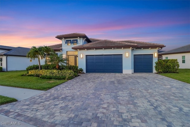 3721 Sapphire Cove Cir, Naples, FL 34114 - view of front of house with decorative driveway, a garage, a front yard, and stucco siding