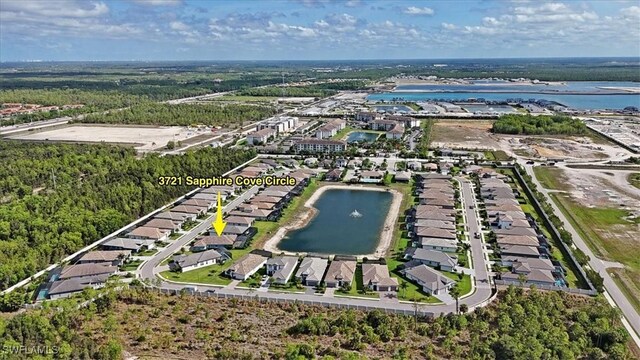 3721 Sapphire Cove Cir, Naples, FL 34114 - aerial perspective of suburban area with a large body of water