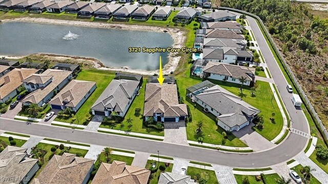 3721 Sapphire Cove Cir, Naples, FL 34114 - aerial perspective of suburban area with a large body of water