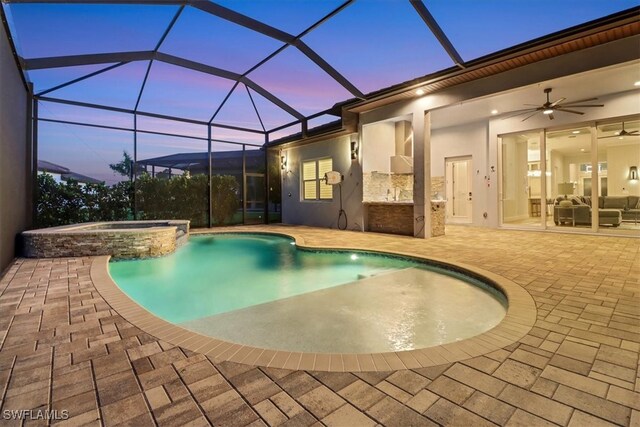 3721 Sapphire Cove Cir, Naples, FL 34114 - pool at dusk featuring a patio, a pool with connected hot tub, and ceiling fan