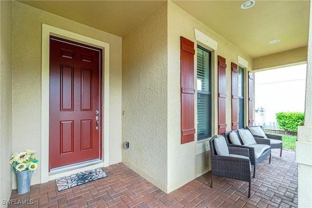 2628 Sherman Oak Dr, North Port, FL 34289 - entrance to property with covered porch and stucco siding