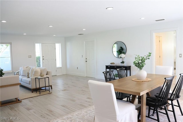dining space featuring visible vents, light wood-style floors, recessed lighting, and a healthy amount of sunlight
