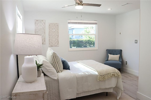 bedroom with visible vents, baseboards, wood finished floors, recessed lighting, and a ceiling fan