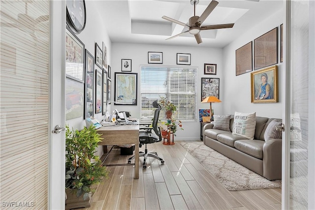 office area featuring wood finish floors, baseboards, and ceiling fan