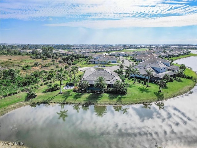 birds eye view of property featuring a water view and a residential view