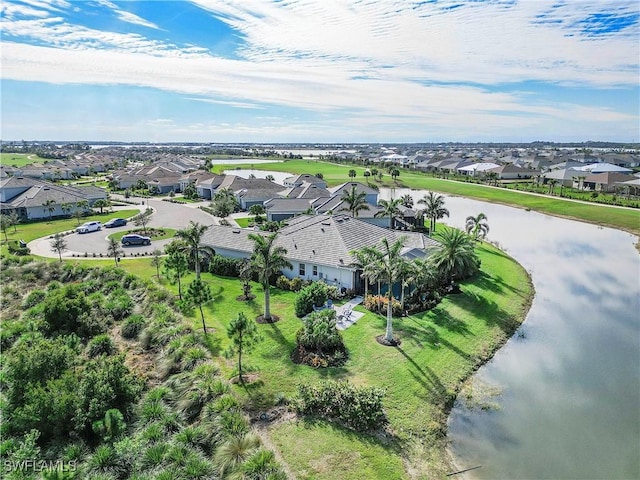birds eye view of property with a residential view and a water view