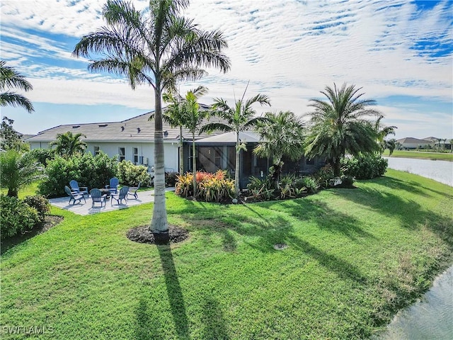 view of yard featuring a patio and a lanai