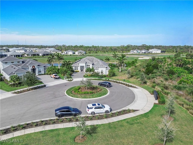 birds eye view of property with a residential view