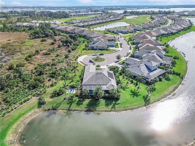 birds eye view of property with a residential view and a water view