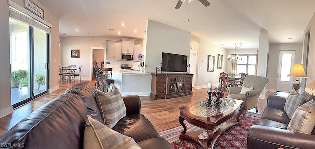 411 SW 19th Ter, Cape Coral, FL 33991 - living room with recessed lighting, light wood-type flooring, baseboards, and ceiling fan