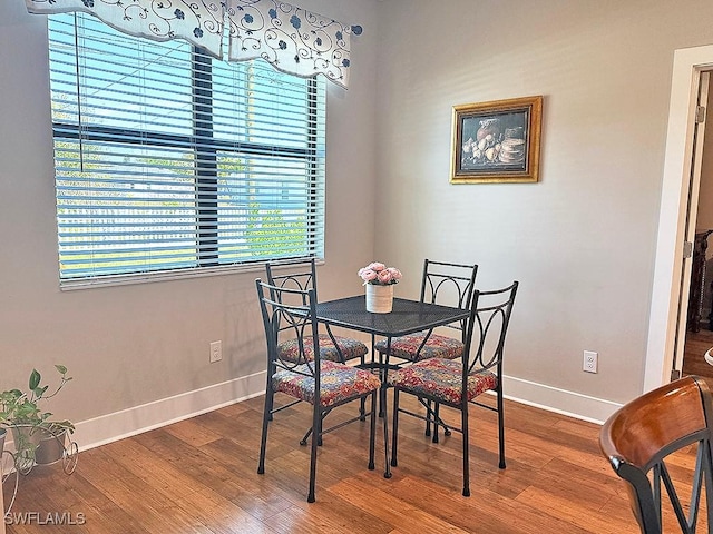 411 SW 19th Ter, Cape Coral, FL 33991 - dining space featuring baseboards and wood finished floors