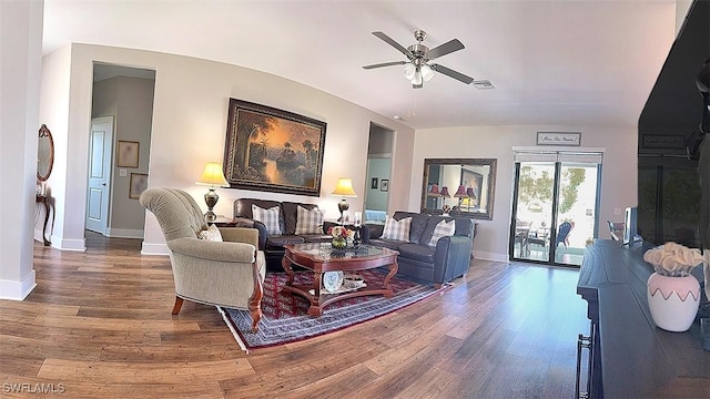 411 SW 19th Ter, Cape Coral, FL 33991 - living area featuring baseboards, lofted ceiling, wood finished floors, and a ceiling fan
