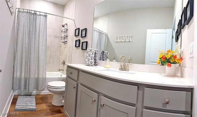 411 SW 19th Ter, Cape Coral, FL 33991 - full bath with vanity, toilet, wood finished floors, and shower / tub combo with curtain