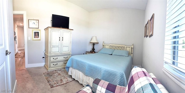 411 SW 19th Ter, Cape Coral, FL 33991 - bedroom featuring baseboards, carpet floors, and vaulted ceiling