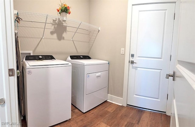 411 SW 19th Ter, Cape Coral, FL 33991 - clothes washing area with washer and dryer, wood finished floors, and laundry area