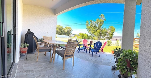 411 SW 19th Ter, Cape Coral, FL 33991 - view of patio featuring outdoor dining area and fence