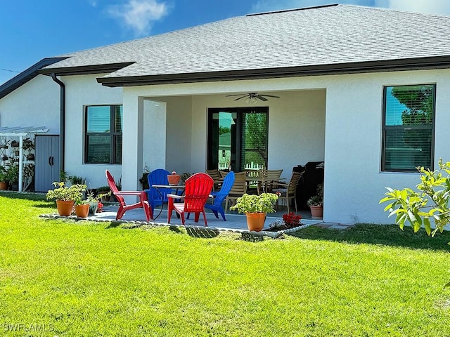 411 SW 19th Ter, Cape Coral, FL 33991 - rear view of property with a yard, a shingled roof, a patio, and a ceiling fan