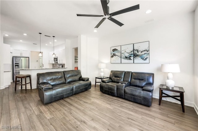 1420 14th Ave NE, Naples, FL 34120 - living area featuring a ceiling fan, light wood-type flooring, recessed lighting, and baseboards
